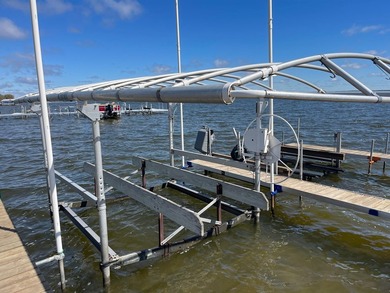 Nestled on the picturesque west shore of Houghton Lake, the - photo 13