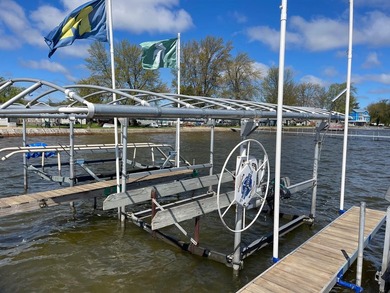 Nestled on the picturesque west shore of Houghton Lake, the - photo 14