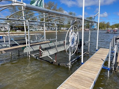 Nestled on the picturesque west shore of Houghton Lake, the - photo 15