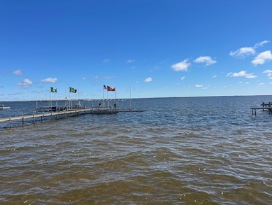 Nestled on the picturesque west shore of Houghton Lake, the - photo 16