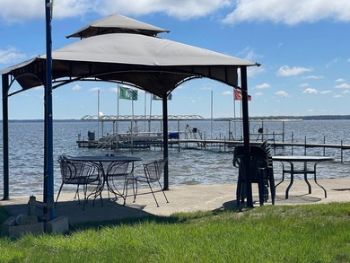 Nestled on the picturesque west shore of Houghton Lake, the - photo 17