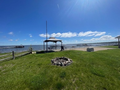 Nestled on the picturesque west shore of Houghton Lake, the - photo 18