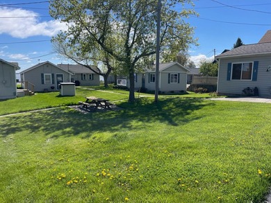 Nestled on the picturesque west shore of Houghton Lake, the - photo 19