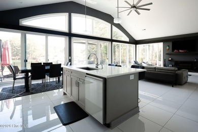 Welcome to this custom lakefront home on Lake Auman, where the - photo 21