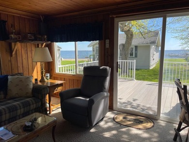 Nestled on the picturesque west shore of Houghton Lake, the - photo 22