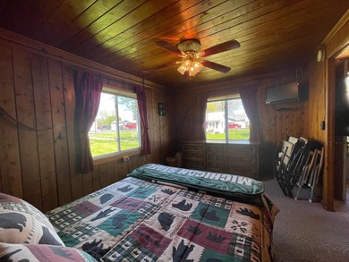 Nestled on the picturesque west shore of Houghton Lake, the - photo 23
