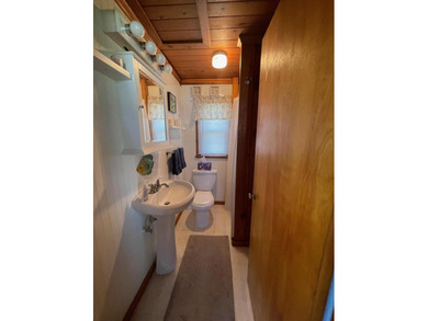 Nestled on the picturesque west shore of Houghton Lake, the - photo 24