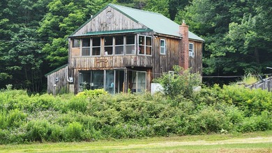 Privacy and seclusion await! This 2-bedroom, 1.5-bath home is - photo 1