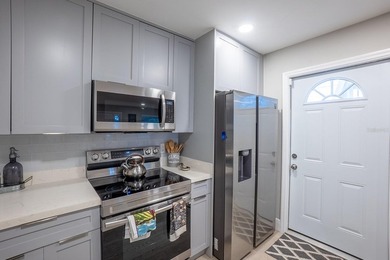 This updated and fully furnished Daytona Beach duplex offers a - photo 19