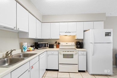 Step into easy coastal living at The Cove-a centrally located - photo 9