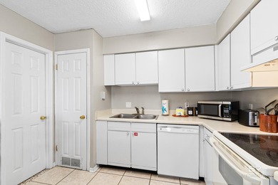 Step into easy coastal living at The Cove-a centrally located - photo 10