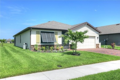 This exquisite 4-bedroom model in highly sought-after gated - photo 1