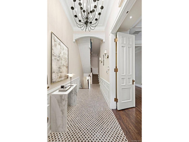 A renovated two-family townhouse nestled less than two blocks - photo 3