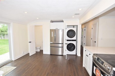 The stunning brand-new eat-in kitchen is the heart of the home - photo 13