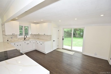 The stunning brand-new eat-in kitchen is the heart of the home - photo 14