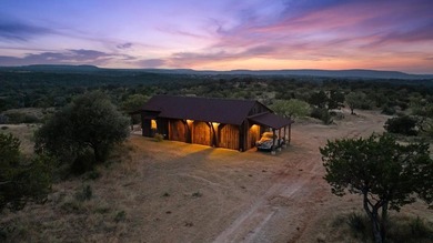 At the heart of the ranch lies a custom two-story home, built in - photo 7