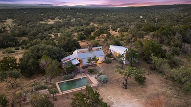 At the heart of the ranch lies a custom two-story home, built in - photo 8