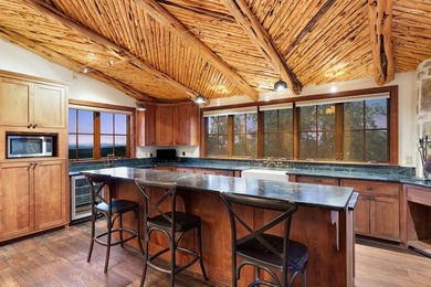 At the heart of the ranch lies a custom two-story home, built in - photo 10