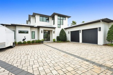 This fabulous GOLD FORTIFIED home is located on Old River with - photo 2