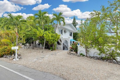 This three bedroom , two bathroom home sits on an expansive 12 - photo 17
