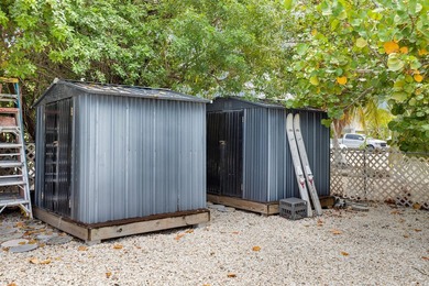 This three bedroom , two bathroom home sits on an expansive 12 - photo 21