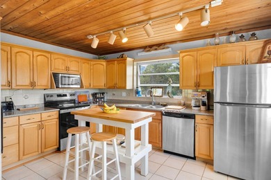 This three bedroom , two bathroom home sits on an expansive 12 - photo 29