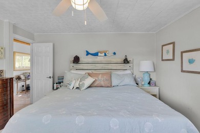 This three bedroom , two bathroom home sits on an expansive 12 - photo 32