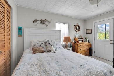 This three bedroom , two bathroom home sits on an expansive 12 - photo 33
