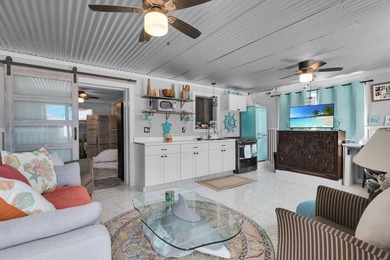 This three bedroom , two bathroom home sits on an expansive 12 - photo 36