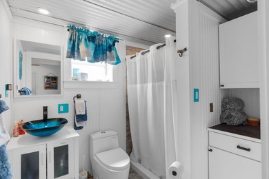 This three bedroom , two bathroom home sits on an expansive 12 - photo 38