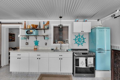 This three bedroom , two bathroom home sits on an expansive 12 - photo 41