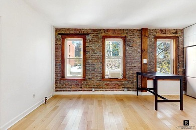Welcome to this sun-filled, recently renovated two-bedroom home - photo 2
