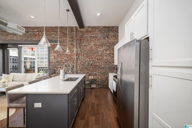 Perfectly positioned in the heart of downtown, this exceptional