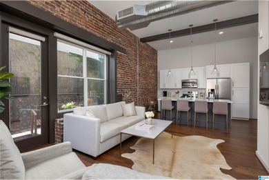 Perfectly positioned in the heart of downtown, this exceptional