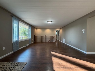 This three-bedroom, two-bathroom home sits across the bay from - photo 38