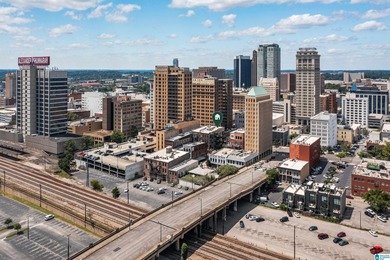 Perfectly positioned in the heart of downtown, this exceptional