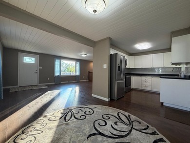 This three-bedroom, two-bathroom home sits across the bay from - photo 44