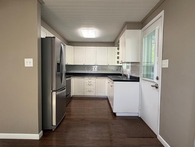 This three-bedroom, two-bathroom home sits across the bay from - photo 47