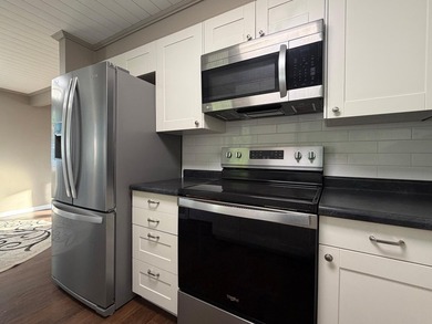 This three-bedroom, two-bathroom home sits across the bay from - photo 48
