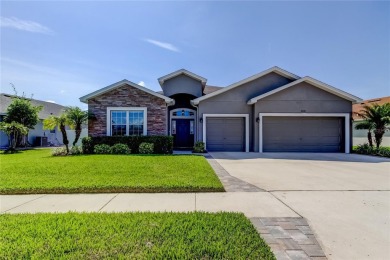 Welcome to this beautifully upgraded 4-bedroom, 3-bath home with - Lake Home For Sale in Zephyrhills, Florida