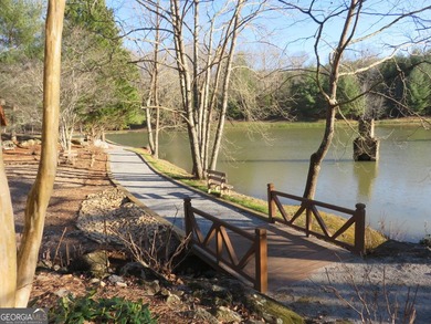 Beautiful partially wooded homesite with some slope. One of the - photo 4