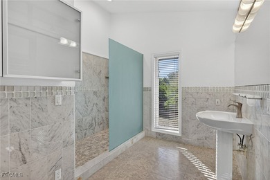 Welcome to 4400 Gulf Pines Drive, an elevated coastal home set