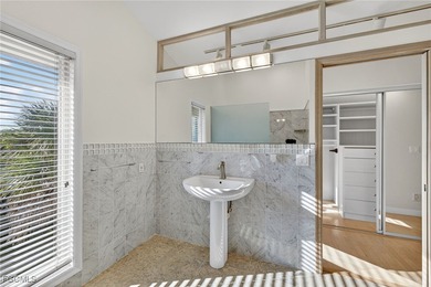 Welcome to 4400 Gulf Pines Drive, an elevated coastal home set