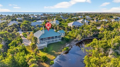 Welcome to 4400 Gulf Pines Drive, an elevated coastal home set