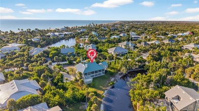 Welcome to 4400 Gulf Pines Drive, an elevated coastal home set