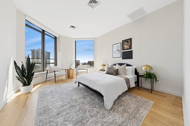 Perched on a high floor, this exceptional penthouse offers - photo 6