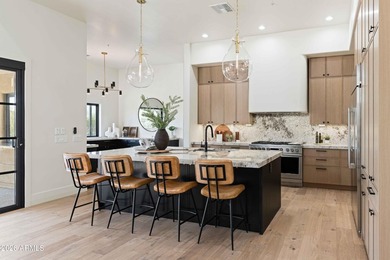 Experience elevated desert living in this meticulously - photo 1