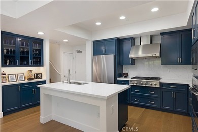 Welcome to 150 The Promenade N #202, a fully renovated - photo 1