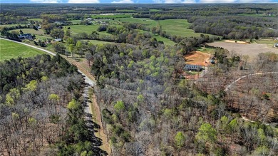 Looking for acreage? This 3.5 acre wooded tract is ideally - photo 8