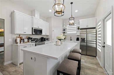 Stunning golf-course home located in a highly sought-after gated - photo 5